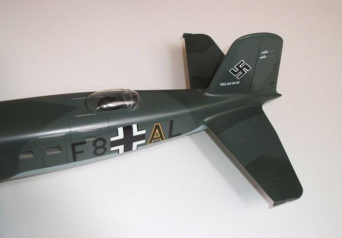 Rear upper fuselage rotating machine gun and sliding canopy